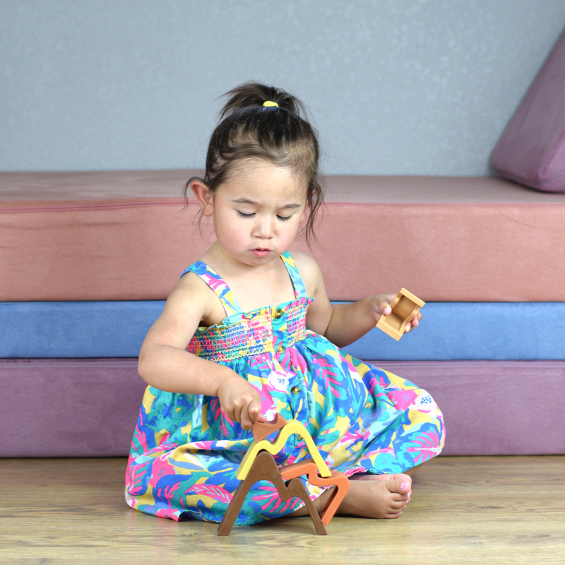 girl playing with silicone stacker